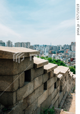 Naksan fortress wall road and Seoul cityscape in Seoul, Korea 65715019