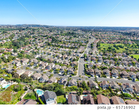 Aerial view of upper middle class neighborhood in the valley with blue sky 65716902