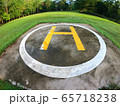 Closeup of helipad for landing helicopters on asphalt ground 65718238