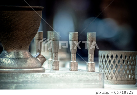 Man is holding object printed on metal 3d printer. 65719525