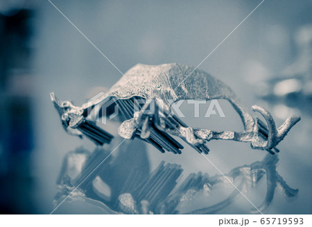 Object printed on metal 3d printer close-up. Object printed on metal 3d printer close-up. 65719593