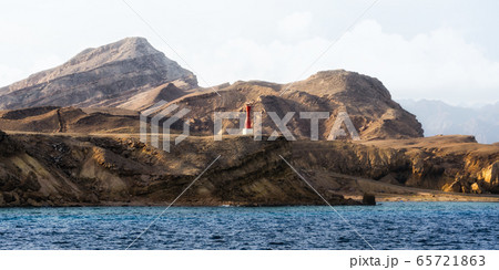 lighthouse on the rocky shore of the Red Sea without people in Egypt landscape lighthouse on the rocky shore of the Red Sea without people in Egypt landscape 65721863