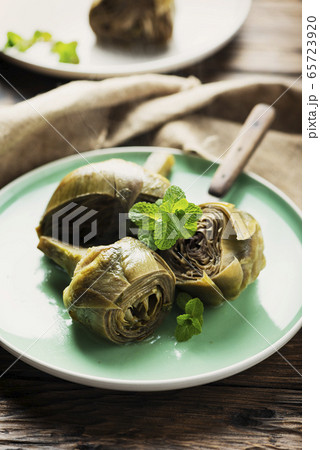 Traditional italian artichoke alla romana Traditional italian artichoke alla romana 65723920