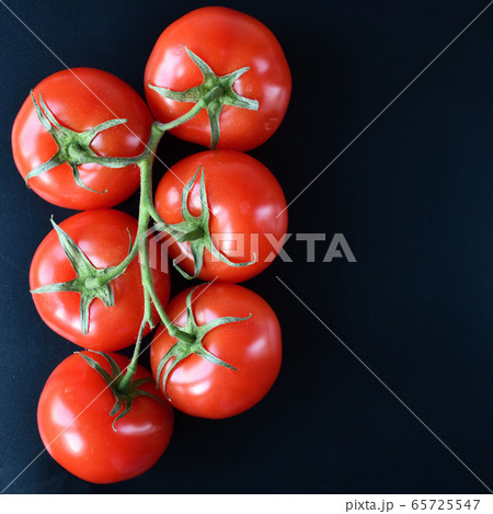 Tomato on branch top view 65725547