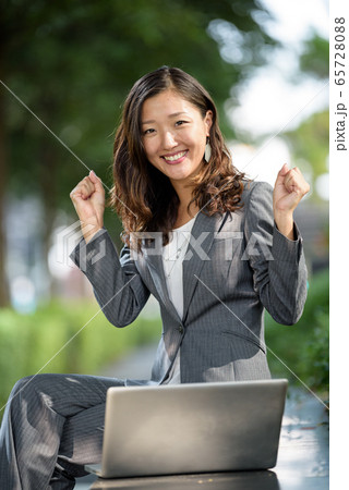 Businesswoman celebrate success Businesswoman celebrate success 65728088