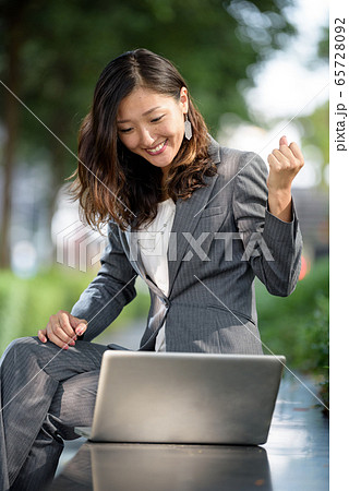 Businesswoman celebrate success Businesswoman celebrate success 65728092