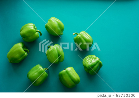 Bulgarian peppers are green on a green background. Fresh and crunchy.Vegetarian food. 65730300