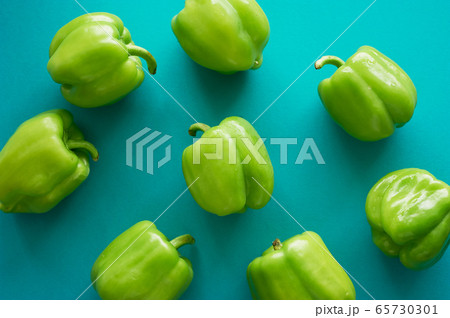 Bulgarian peppers are green on a green background. Fresh and crunchy.Vegetarian food. Texture 65730301
