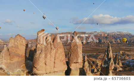 Beautiful Nature of Cappadocia on with balloons on a background of camel rocks. Turkey. 65736603
