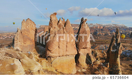 Beautiful Nature of Cappadocia on with balloons on a background of camel rocks. Turkey. 65736604