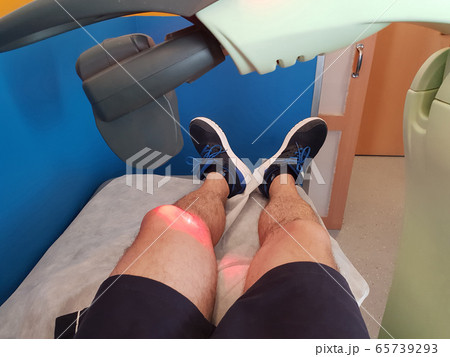 Physical therapy using a laser to treat an injured 65739293