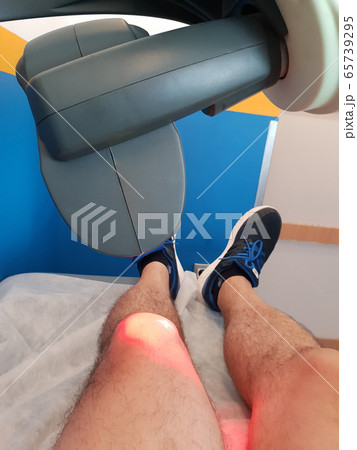 Physical therapy using a laser to treat an injured 65739295