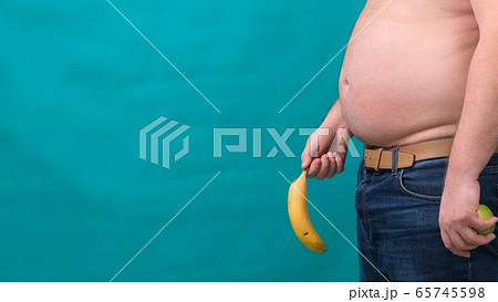 old limp drooping banana hanging from genital area of clothed unrecognizable man, impotence erectile old limp drooping banana hanging from genital area of clothed unrecognizable man, impotence erectile 65745598