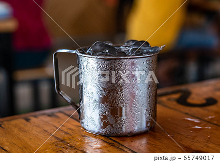 Water in aluminum glass, water droplets adhering Water in aluminum glass, water droplets adhering 65749017