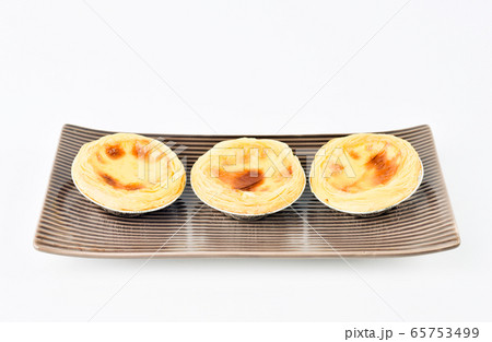 Egg tart, traditional Portuguese dessert Egg tart, traditional Portuguese dessert 65753499