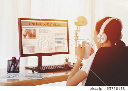 Businesswoman Reading News On Computer Businesswoman Reading News On Computer 65756158