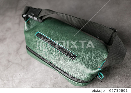 Belt bag made of dark green textured leather, 65756691