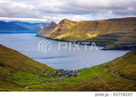 Panorama of mountains around village of Funningur on Faroe Islands 65758207