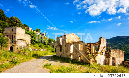Ruined buildings of an abandoned city. 65760633