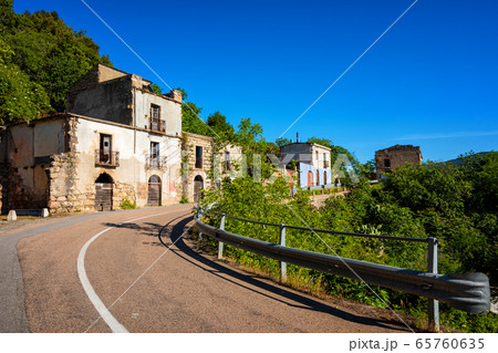 Ruined buildings of an abandoned city. 65760635