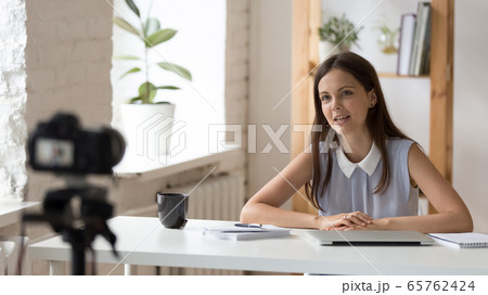 Young female coach shoot live broadcast on camera 65762424