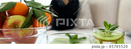 Ecological natural fruits on table and in drinks. Ecological natural fruits on table and in drinks. 65765520