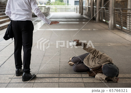 Businessman refuse homeless old man 65766321