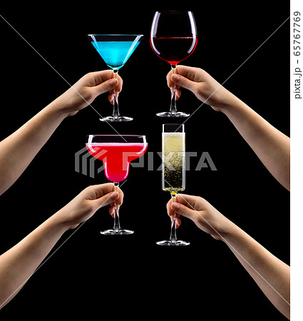 Set of hands holding cocktails isolated on black 65767769