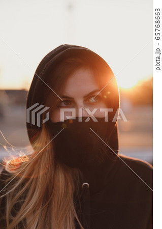 Pretty girl in black medical mask Pretty girl in black medical mask 65768663