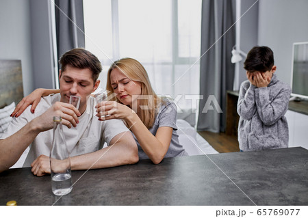 desperate child tired of parents alcoholics 65769077