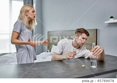 young man tired of hysterical wife 65769078