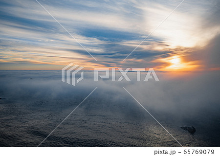 Ocean mist or fog on a beach at sunset. Magnificent aerial view 65769079