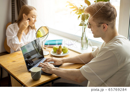 beautiful young couple spend morning differently beautiful young couple spend morning differently 65769284