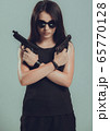 Shot of a sexy military woman posing with 65770128