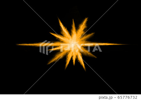 Freeze motion of yellow dust explosion isolated on black background. 65776732