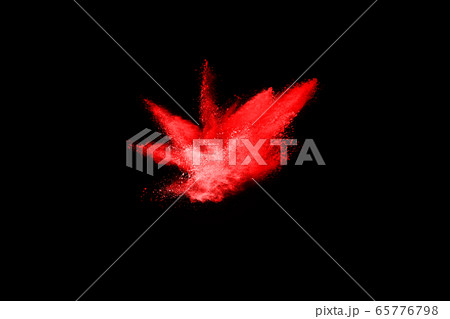 abstract red powder explosion on black background.abstract red powder splatted on black background. Freeze motion of red powder exploding. 65776798