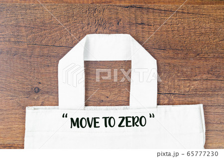 Move to Zero waste. Textile eco bags on wooden Move to Zero waste. Textile eco bags on wooden 65777230