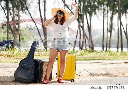 Female tourist taking selfie 65779138