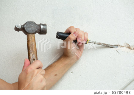 Repair of the premises. A man makes a ditch for 65780498