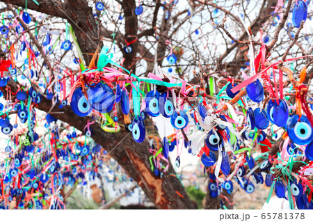 Evil eye charms hang from a tree, Cappadocia, Evil eye charms hang from a tree, Cappadocia, 65781378