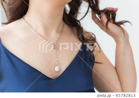 Close-up of woman wearing a Jewelry, bijouterie and accessories. Close-up of woman wearing a Jewelry, bijouterie and accessories. 65782813