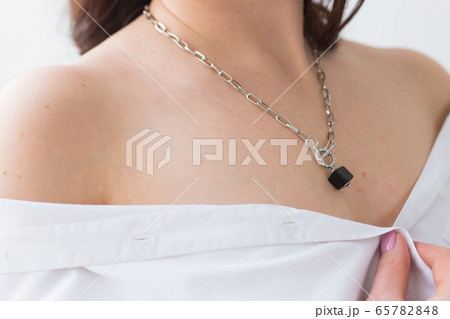Close-up of woman wearing a Jewelry, bijouterie and accessories. Close-up of woman wearing a Jewelry, bijouterie and accessories. 65782848