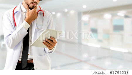 Doctor using tablet computer at the hospital. 65792553