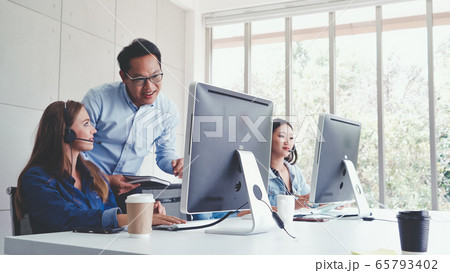 Customer support agent or call center with headset 65793402