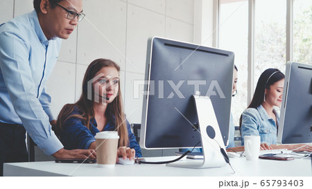 Customer support agent or call center with headset 65793403