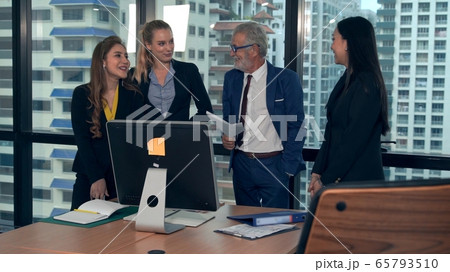 Professional business people discuss financial issue in group meeting at company office. Professional business people discuss financial issue in group meeting at company office. 65793510