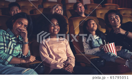 People audience watching movie in cinema theater. People audience watching movie in cinema theater. 65795051