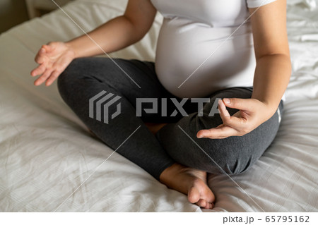 Happy pregnant woman and expecting baby at home. 65795162