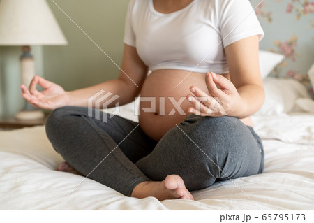 Happy pregnant woman and expecting baby at home. 65795173