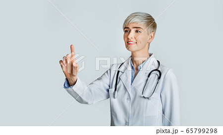 Doctor hand touching empty virtual screen. Friendly woman and modern technology 65799298